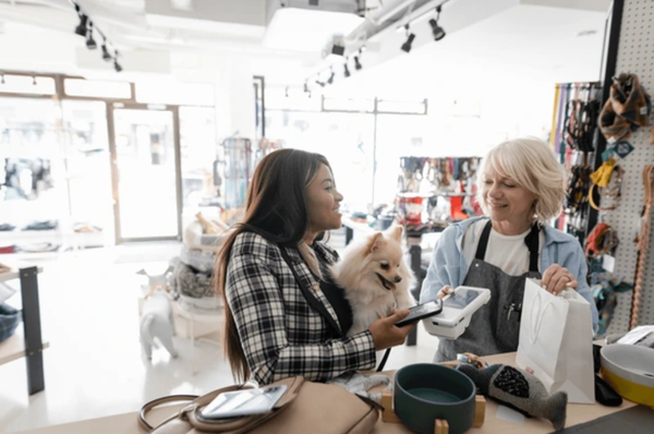A customer is discussing with the staff at the pet store